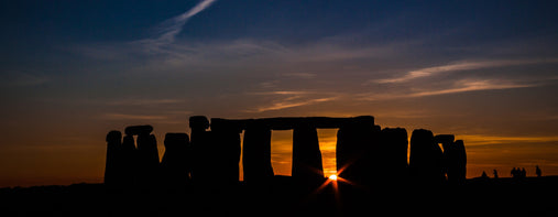 view of Stonehenge at sunset during the Summer Solstice